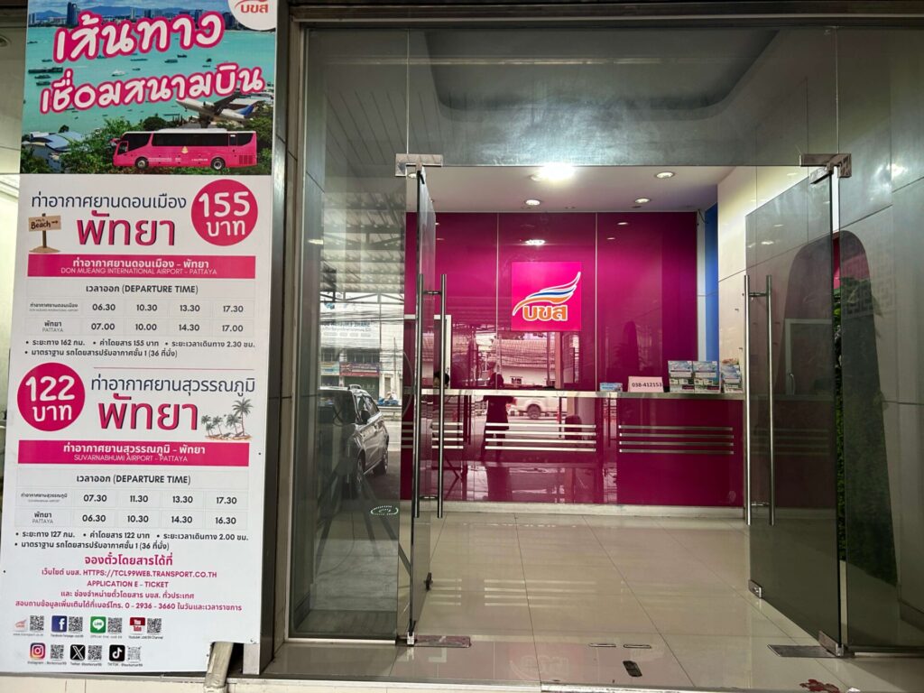 Entrance to the Bor Kor Sor office in Pattaya with a poster displaying bus departure times and fares 