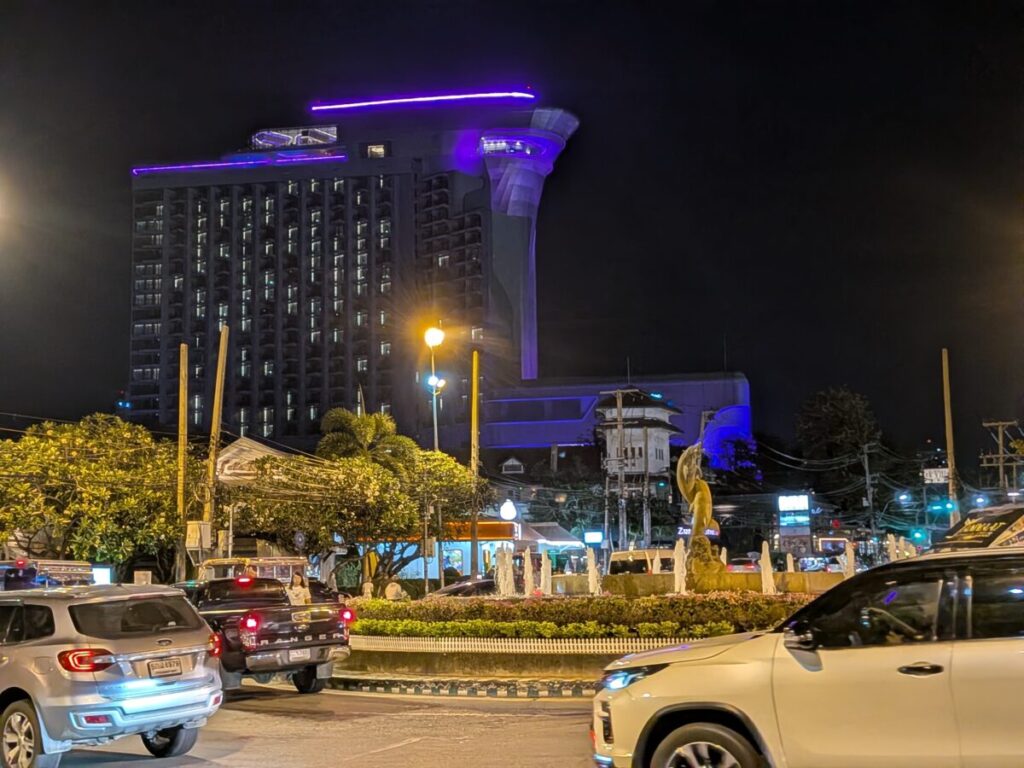 The night view of the North Pattaya skyline, featuring the distinctive, brightly lit Grande Centre Point Space Pattaya hotel.