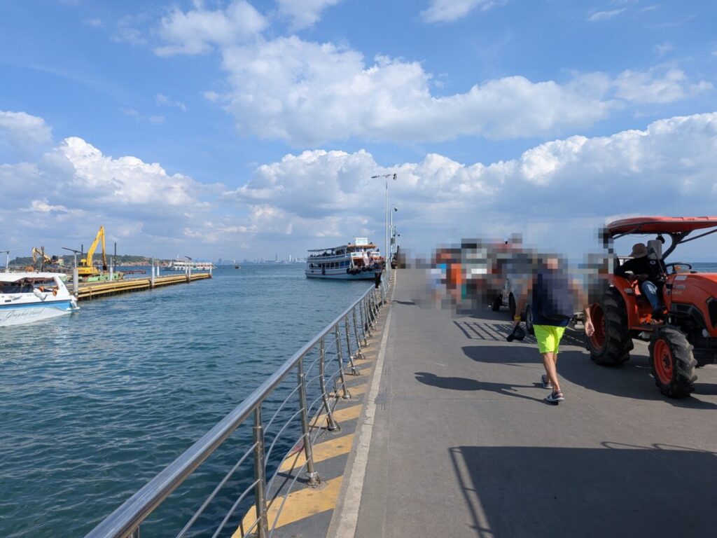 Passengers walking along the jetty at Na Baan Pier towards the ferry for the return trip to Pattaya.