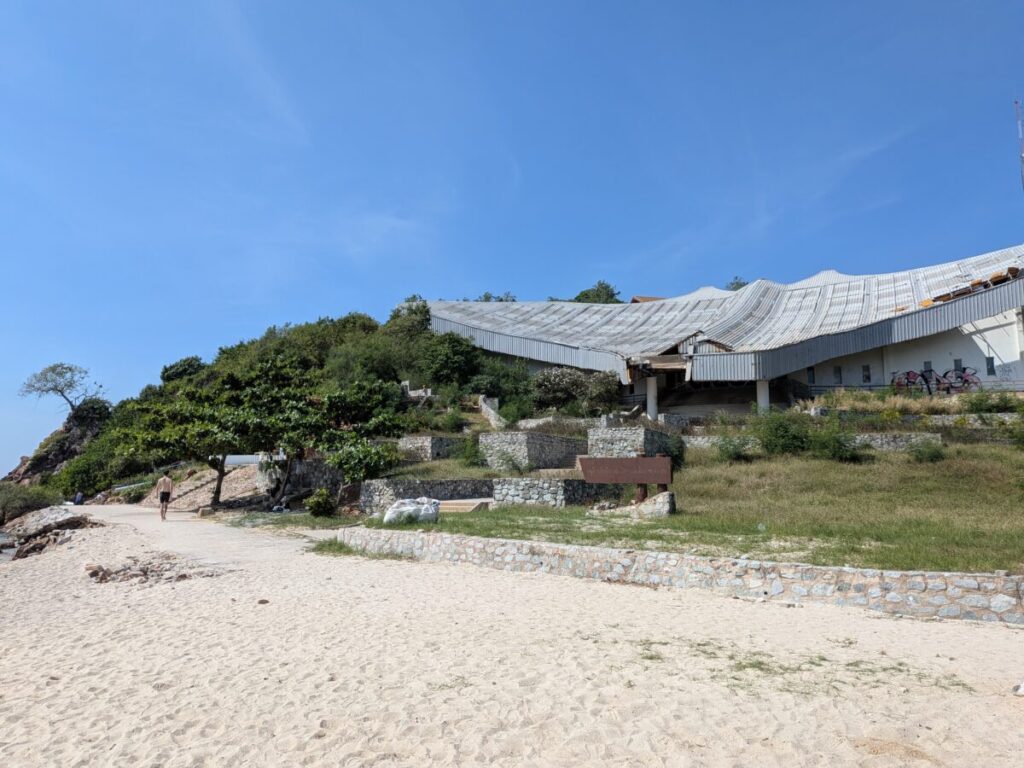 Samae Beach Viewpoint showing the distinctive fan-shaped abandoned structure and the steep staircase leading to the hilltop for panoramic views.