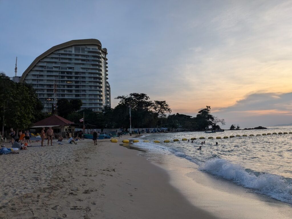 Wide view of Wong Amat Beach with calm waves and clear sand.