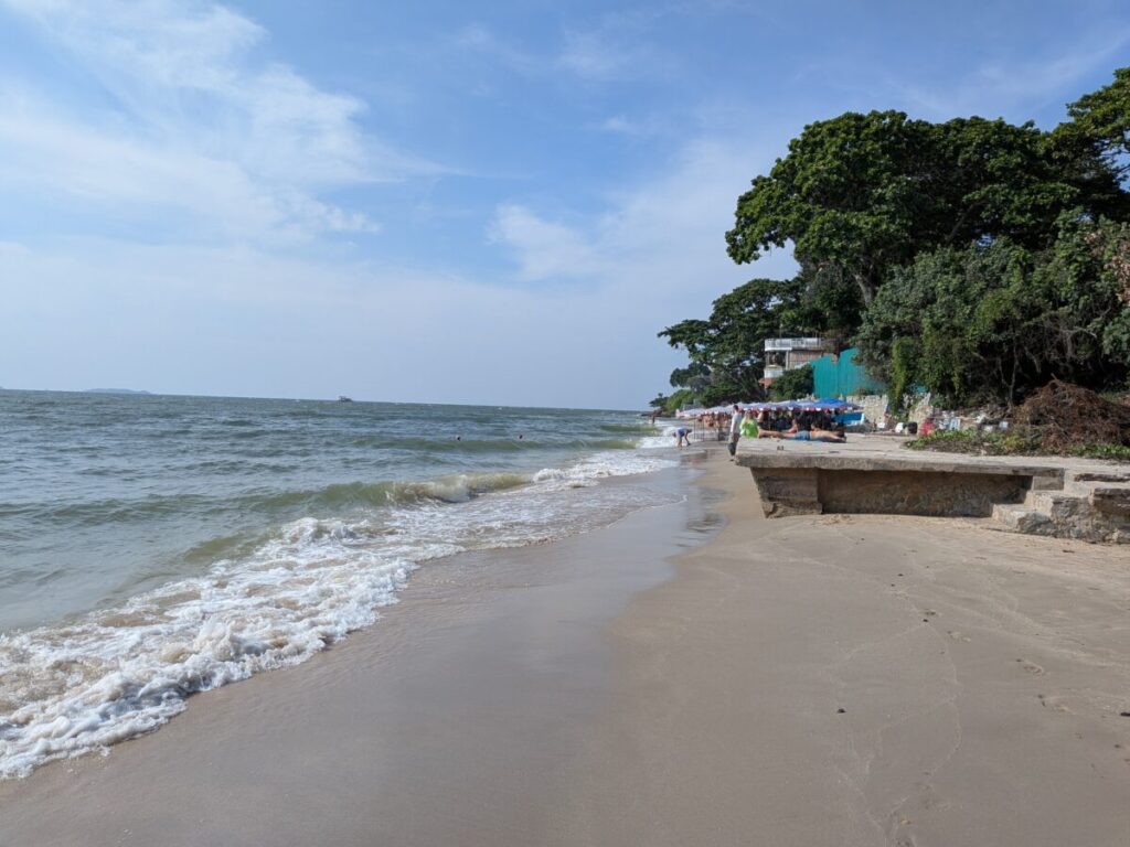 Paradise Beach Pattaya shoreline view after walking down Phra Tam Nak 4 Alley stairs