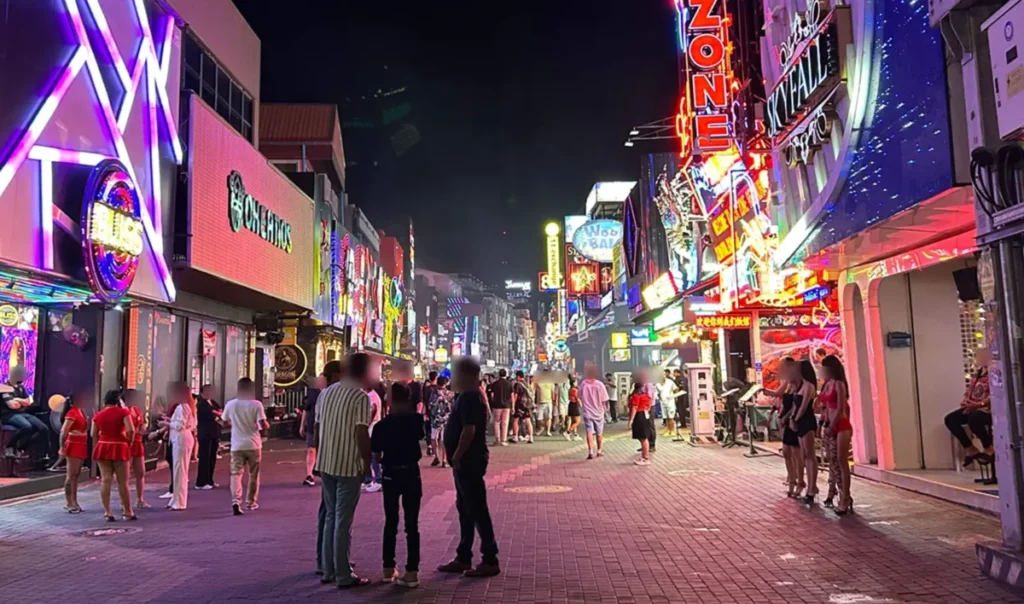 The bright neon signs of Walking Street in Pattaya at night, where most nightlife-related misunderstandings occur.