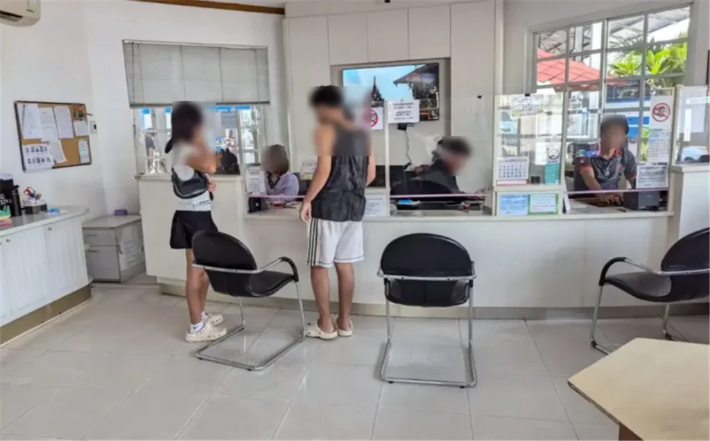 Inside the Bell Travel Service office in Pattaya, showing the check-in and ticket counters for airport transfers.