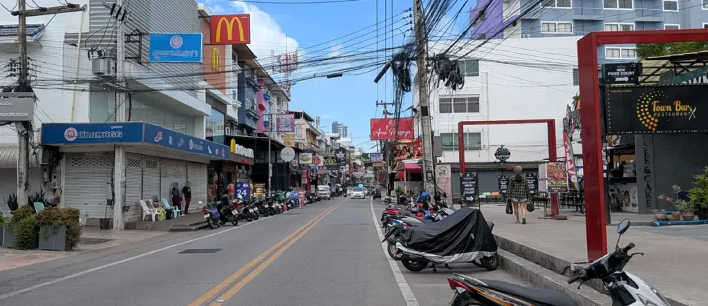 Soi Buakhao daytime street view with local shops, motorcycles, and everyday Pattaya life