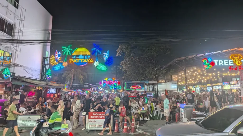 Tree Town Pattaya night market area with food stalls, open-air seating, and colorful neon signage