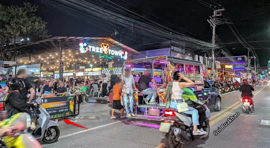 Tree Town entrance on Soi Buakhao at night with vibrant food court lights