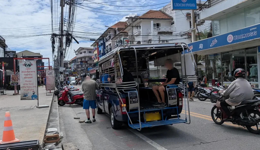 Passenger riding a Pattaya songthaew on Soi Buakhao in Pattaya