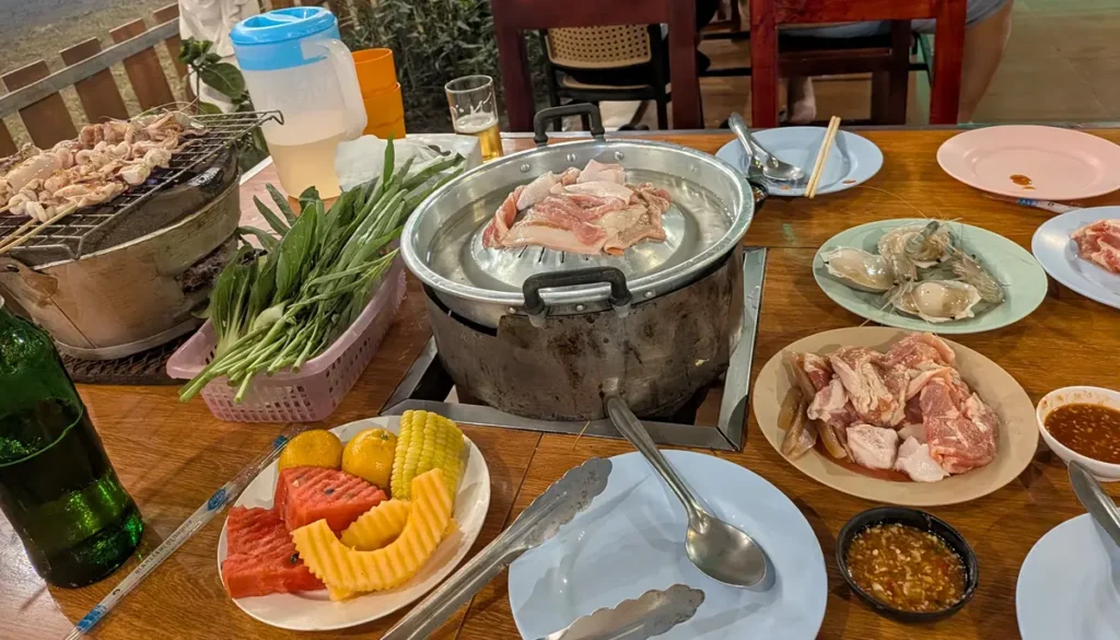 Mookata meal with grilled meat, seafood, vegetables, and a Mookata pan in Pattaya