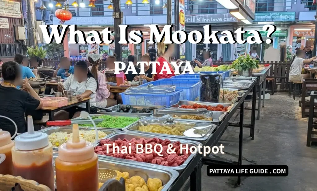 Busy Mookata buffet in Pattaya with fresh ingredients and local diners